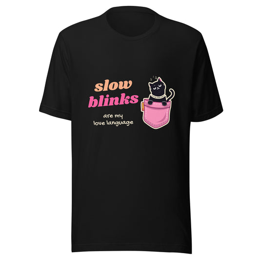 Black unisex t-shirt with a winking black cat in a pink pocket and the words “slow blinks are my love language”