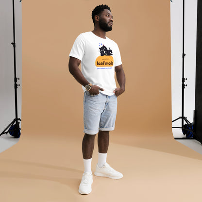 Man wearing a white unisex t-shirt with a black cat sipping boba on an orange loaf and the words “currently in loaf mode”
